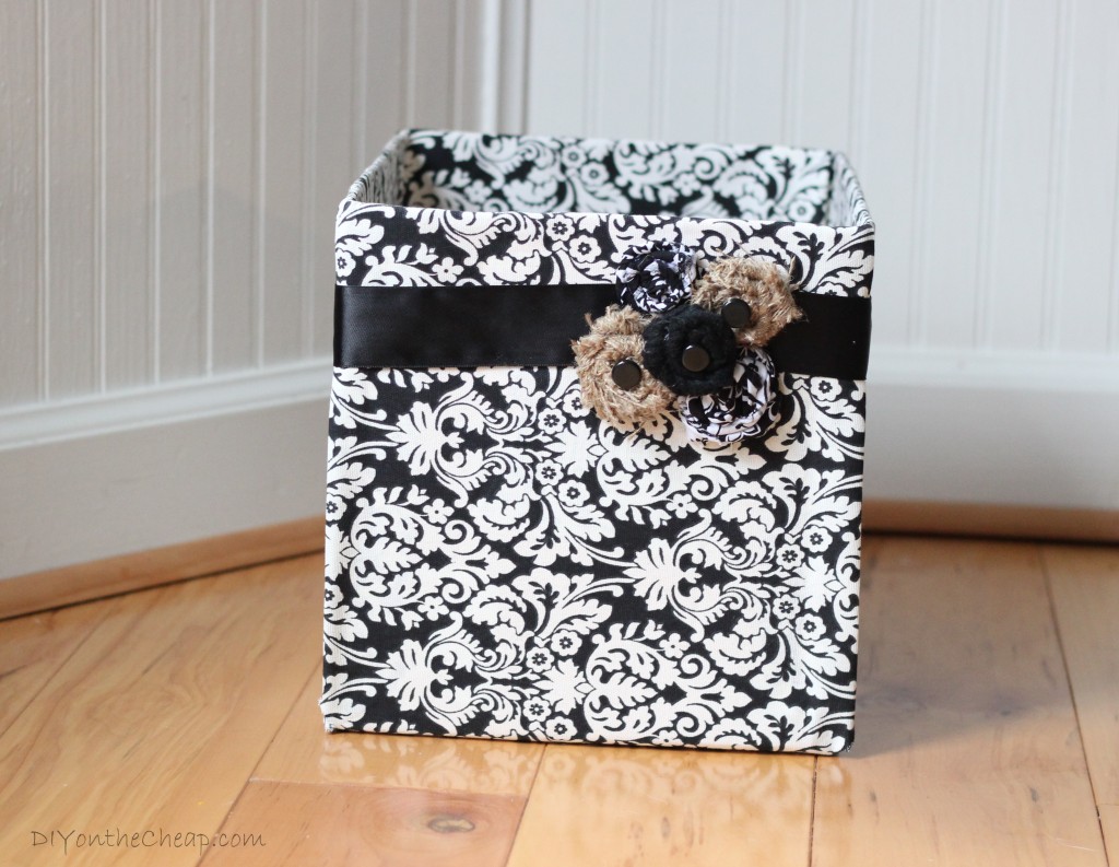 Cover a cardboard box with fabric for an instant (and cute) storage solution!